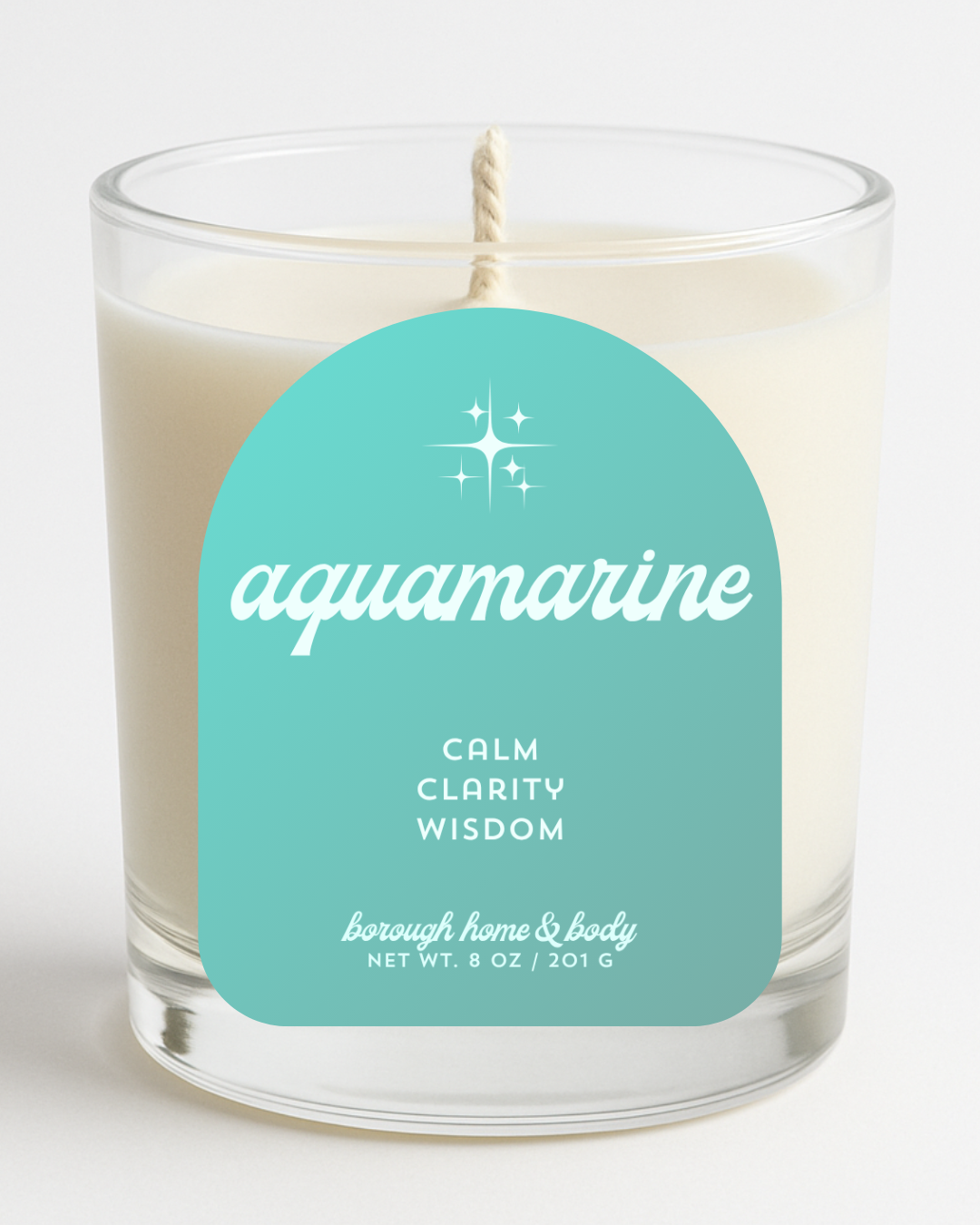Front view of March Aquamarine Birthstone Candle with soft blue label, in an 8 oz clear glass jar on a white background.