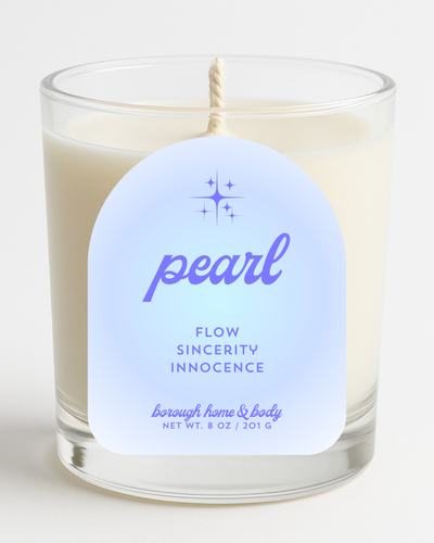 Front view of June Pearl Birthstone Candle with soft ivory label, in an 8 oz clear glass jar on a white background.