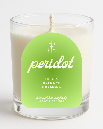 Front view of August Peridot Birthstone Candle with bright green label, in an 8 oz clear glass jar on a white background.