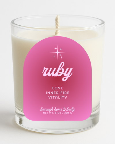 Front view of July Ruby Birthstone Candle with bold label, in an 8 oz clear glass jar on a white background.
