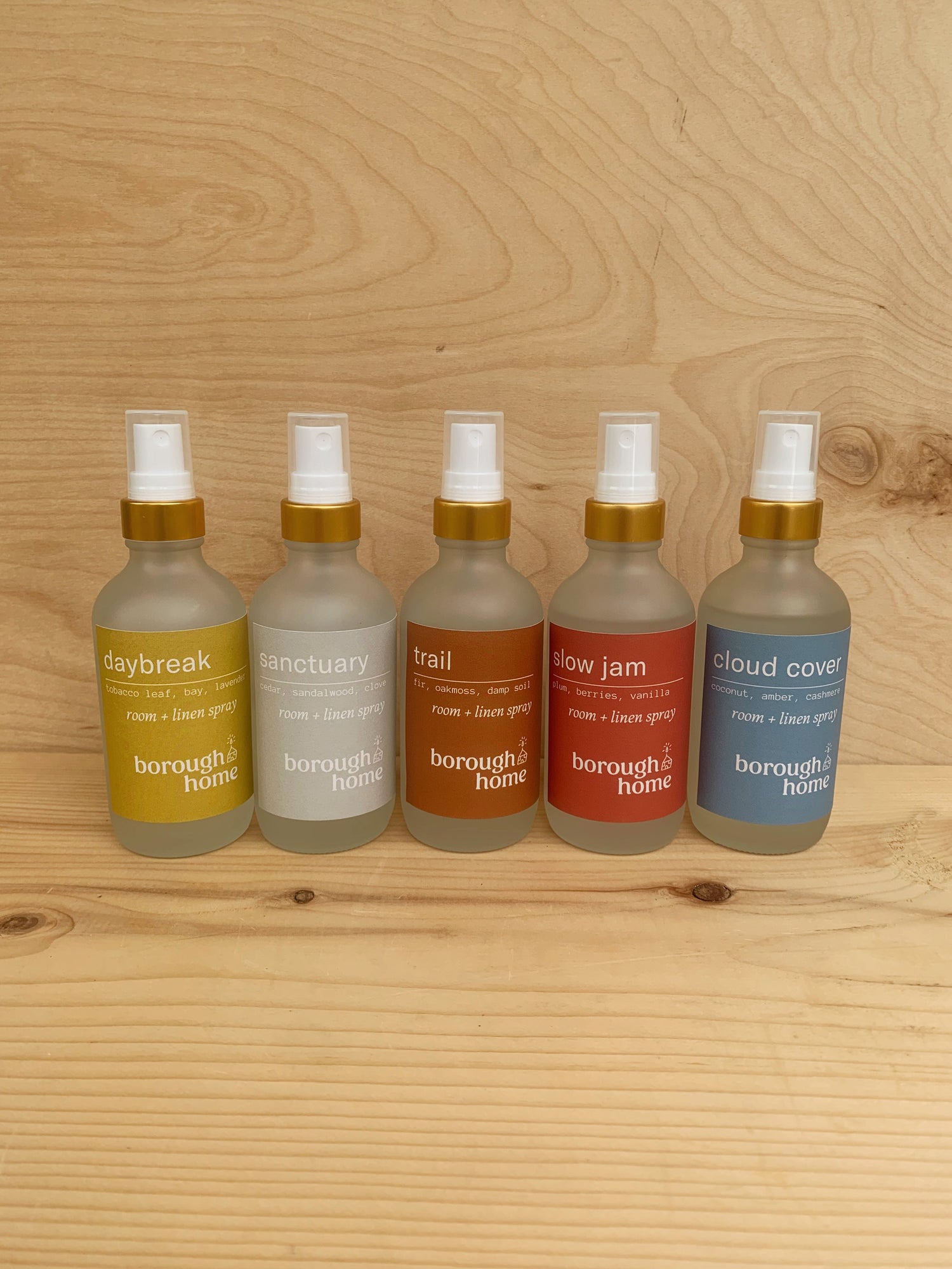 6 Room and Linen Sprays lined up, front view.