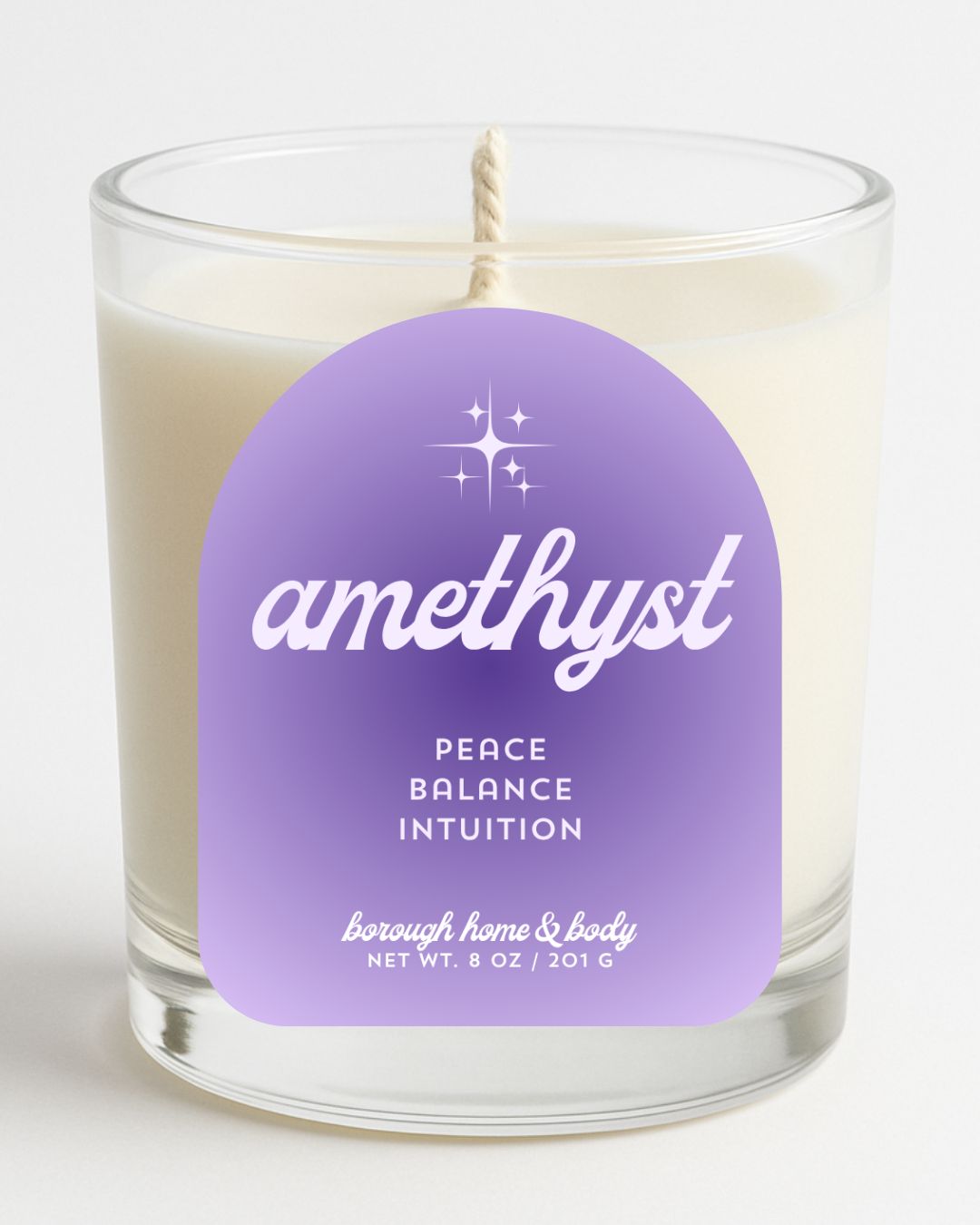 Front view of February Amethyst Birthstone Candle with violet label, in an 8 oz clear glass jar on a white background.