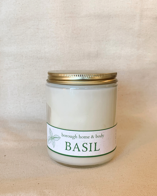 Basil scented candle in clear glass tumbler with gold lid, part of the Botanical Collection, soy wax with vibrant green garden aroma