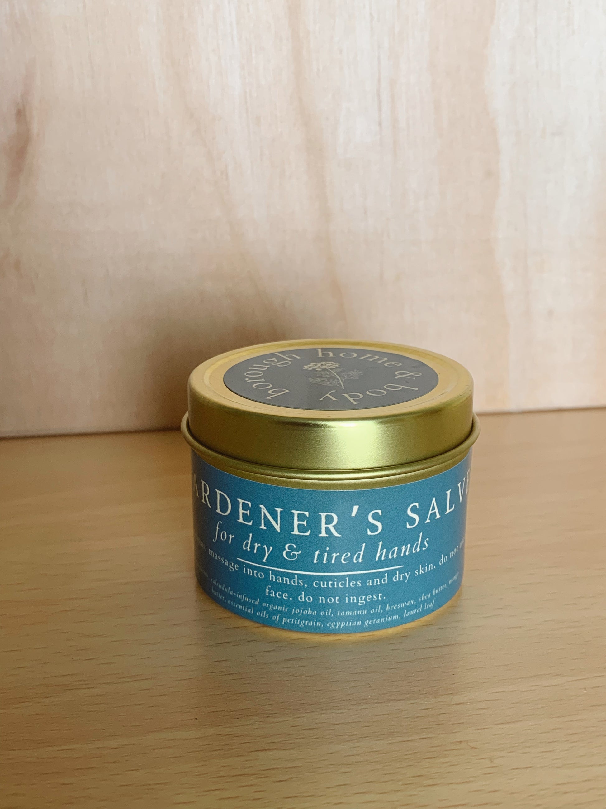 Front view of Gardener's salve in tin